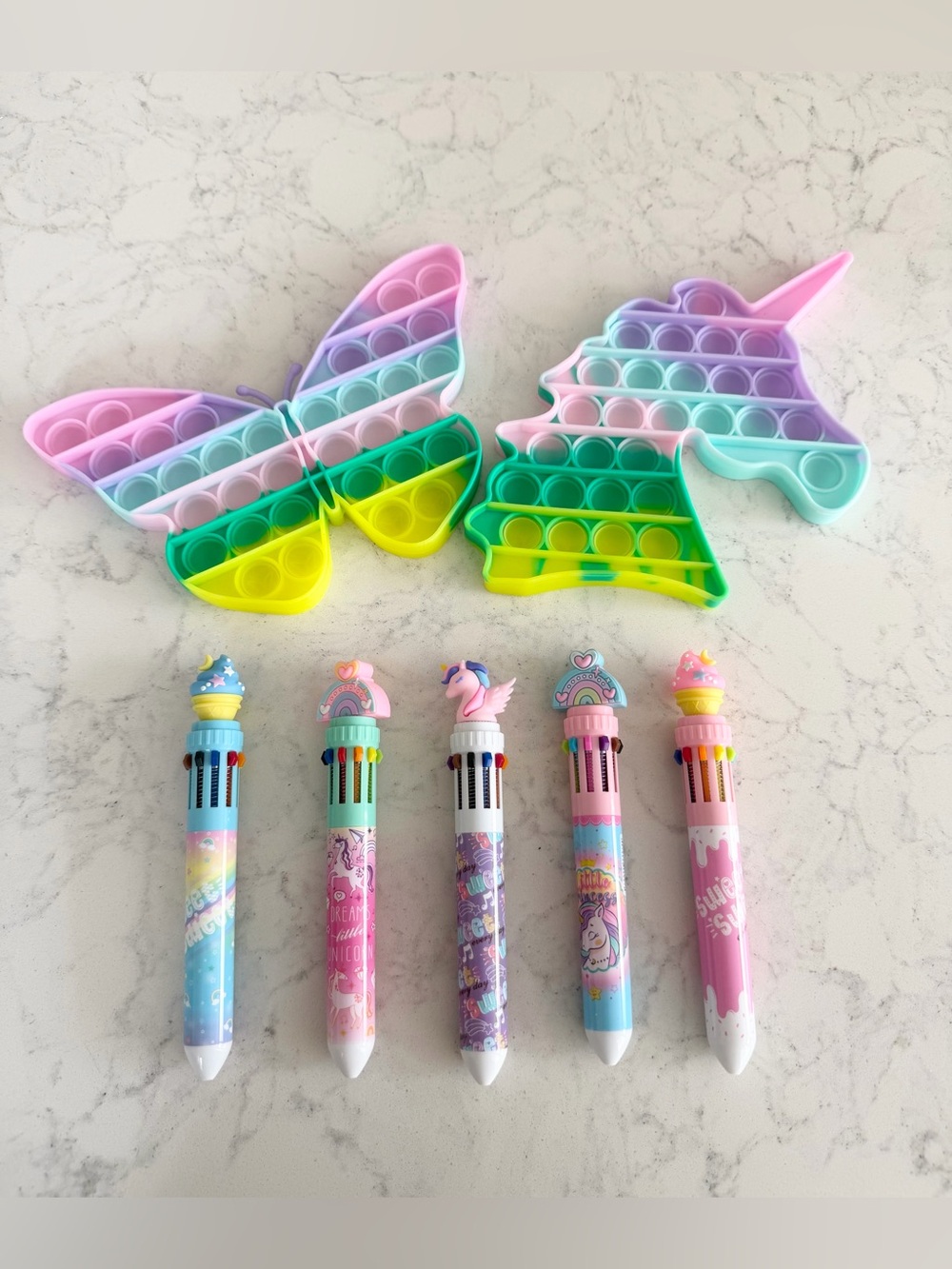 5 Multicolor (10-in-one) Pens and 2 Pop Bubble Fidget Toys, all new items